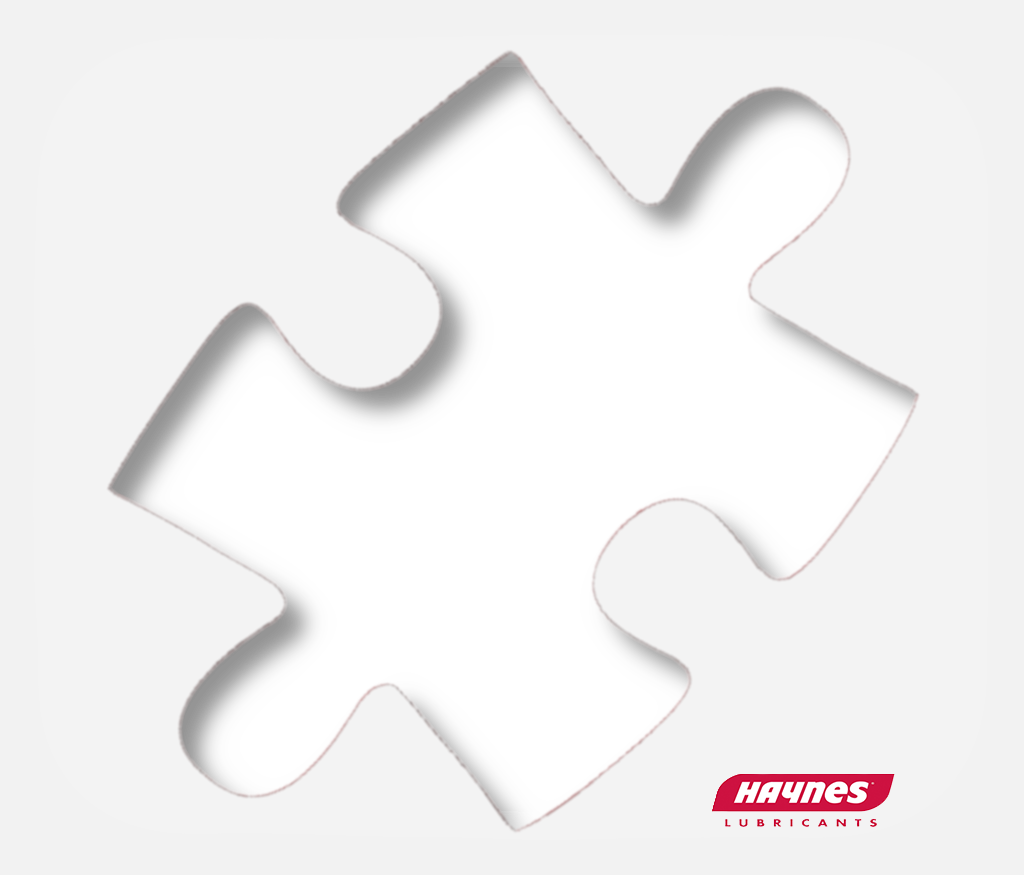 Black puzzle piece with Haynes Lubricants logo on a white background